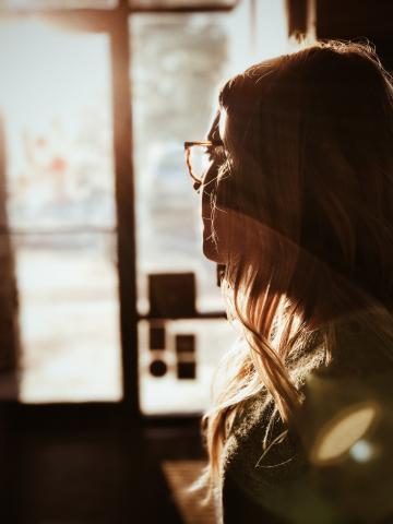 Woman looking out window