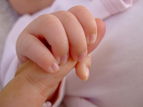 Baby grasping finger