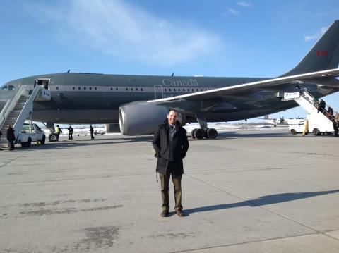 Josh about to board a government jet