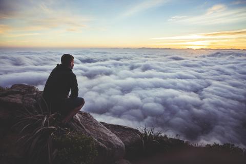 man contemplating clouds make God priority #1