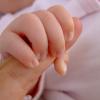 Baby grasping finger